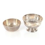 An Edwardian silver sugar bowl, Sheffield 1906; and another with gadrooned border, Sheffield 1920,