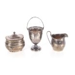 A small silver swing handled sugar bowl, Birmingham 1927; a silver cream jug, Chester 1913 and a