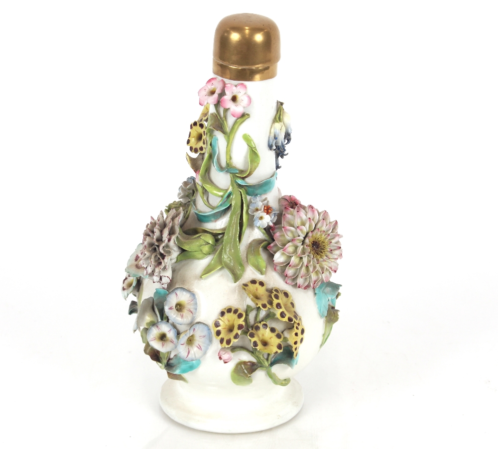 A 19th Century Minton porcelain bottle vase, with profuse floral encrusted decoration and gilt