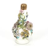 A 19th Century Minton porcelain bottle vase, with profuse floral encrusted decoration and gilt