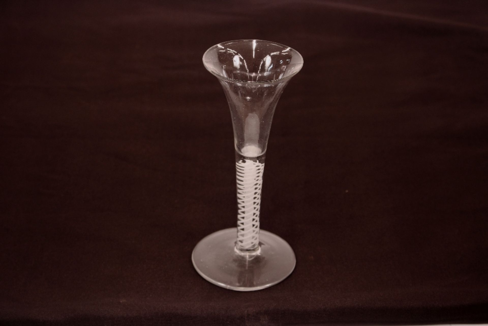 An antique drinking glass, with trumpet shaped bowl and spiral cotton twist stem on circular spread - Image 2 of 4