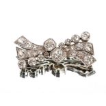 A white metal and diamond set bow brooch, approx. 9.8gms total weight, the largest stone approx. 6mm