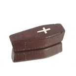 An antique wooden snuff box in the form of a coffin with silver cross to the top