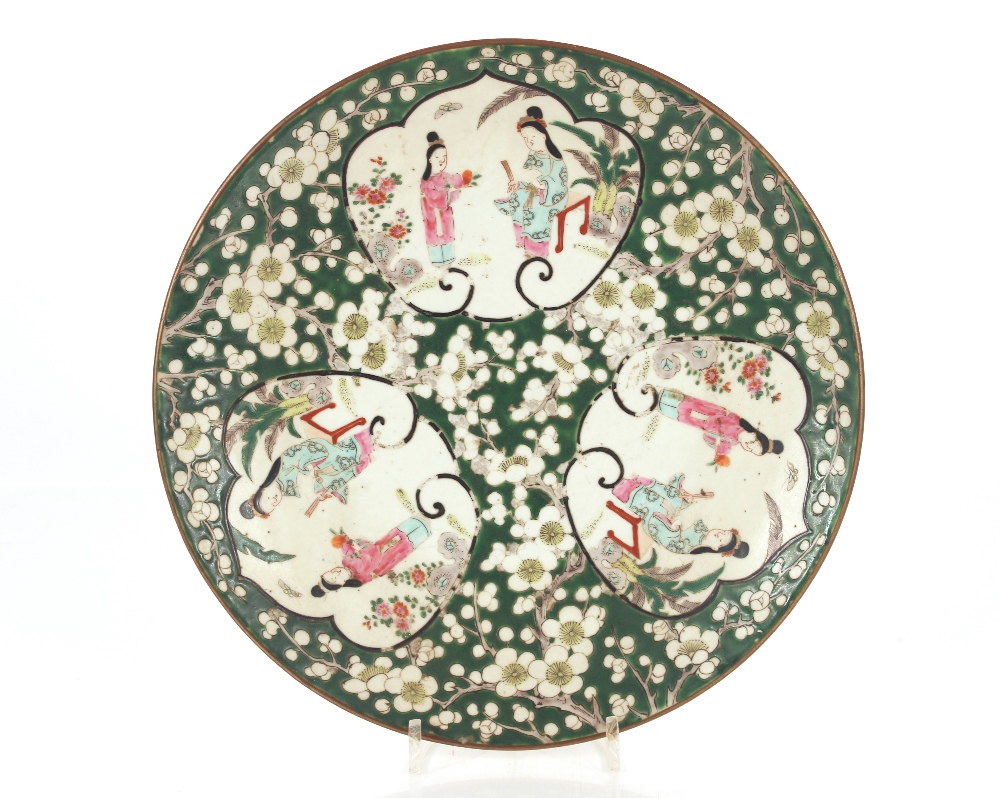 A Chinese plate decorated with three vignettes depicting ladies in garden settings, on a green and - Image 2 of 8