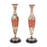 A pair of 19th Century Bohemian overlaid ruby glass baluster vases, profusely decorated floral