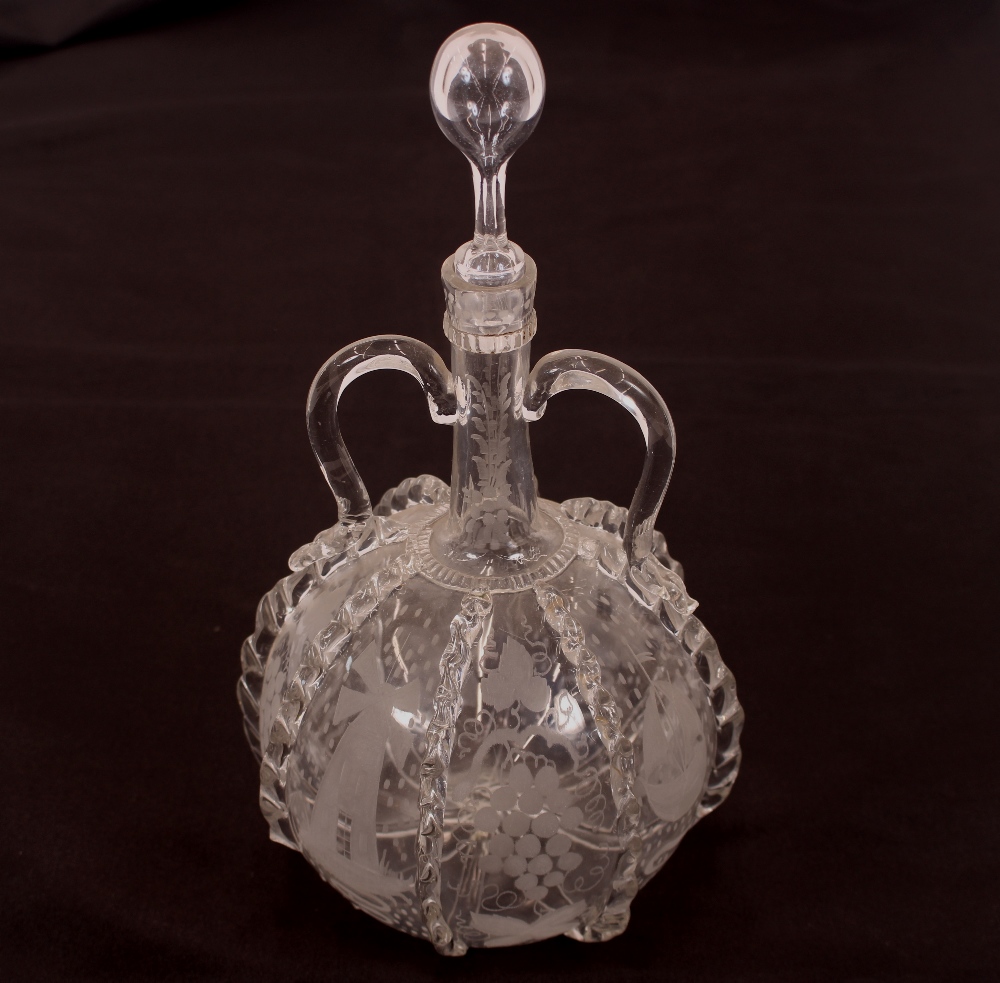 An antique Dutch decanter, with loop twin handles, etched decoration of vine leaves, ships and - Image 2 of 2