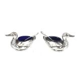 A pair of Edwardian silver duck shaped salts by Robert Pringle, Birmingham 1910, complete with