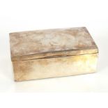An Edwardian silver cigarette box, with wood lined interior, the lid with family crest, 21cm long,