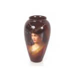 A late 19th Century German porcelain Rembrandt ware vase, hand painted with a young lady and