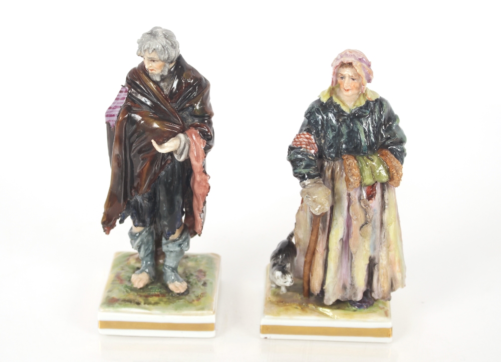 A pair of 19th Century Italian Naples porcelain figures of paupers wearing tattered clothes on - Image 2 of 4