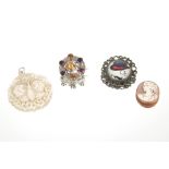 A silver brooch set with large tourmaline, brooch with an unusual head; a fine carved mother of