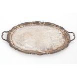 A large silver tea tray, having shaped borders and scrolled handles, Sheffield 1919, 60oz