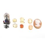 A quantity of miscellaneous items to include three ladies bust cameos; two tested citrine stones;