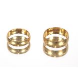 Two 18ct gold wedding bands, approx. 9.2gms; a pair of yellow metal hoop ear-rings and a circular