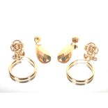 A pair of hoop ear-rings marked 14K, approx. 2gms; a pair of yellow metal drop ear-rings marked