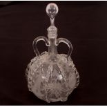 An antique Dutch decanter, with loop twin handles, etched decoration of vine leaves, ships and