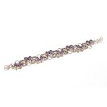 A silver and amethyst bracelet