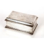 A George V silver cigarette box, with engine turned decoration, monogram to lid, London1919: another