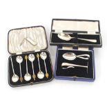 A cased set of six silver bean top coffee spoons; a cased silver child's spoon and pusher;  a