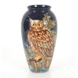 A limited edition Moorcroft vase, decorated with an eagle owl, 234/500, 32cm high