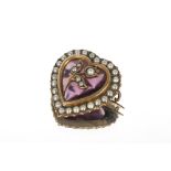 A yellow metal and amethyst coloured brooch, of heart shape set seed pearls