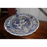 A large Chinese blue and white charger with dragon