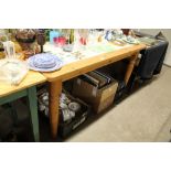 A pine and tile top kitchen table