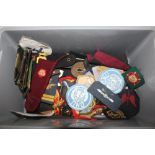 A box of military cloth badges etc.