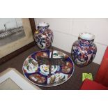 An Imari pattern charger and a pair of Imari decor