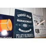 A tin sign advertising "Peaky Blinders"