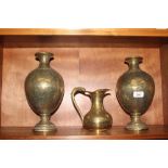 A pair of Indian brass baluster vases and a simila