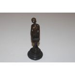 A bronze Art Nouveau style figure of a girl with t