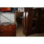 A light oak mirrored door cupboard