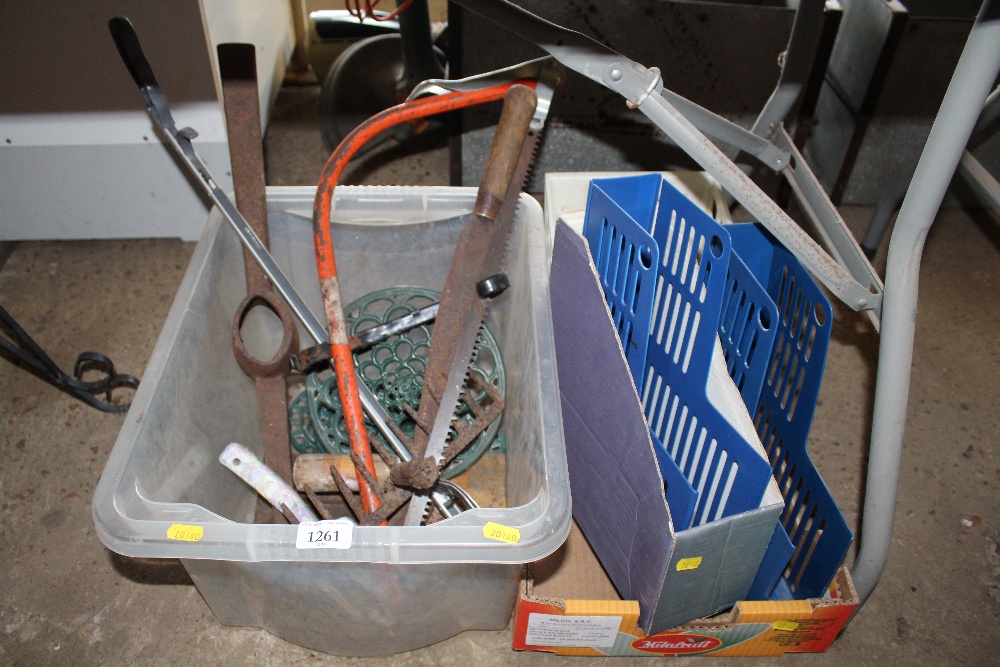 A box containing gardening tools and file boxes