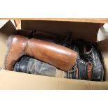 A box of leather and other boots and boot trees