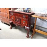 A reproduction carved mahogany lowboy fitted with an arrangement of four drawers AF