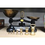 A set of scales and a collection of brass bell wei