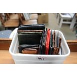 A box of leather and other wallets