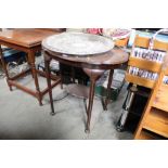 A mahogany shaped top window table