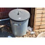 A galvanised bin and lid