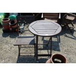 A folding garden table and folding garden chair