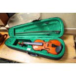 A cased violin and bow