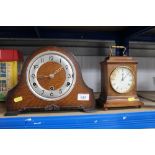 A walnut cased mantel clock and an oak cased three