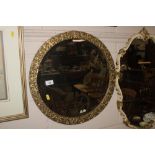 A circular gilt framed and bevel edged wall mirror