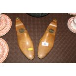 A pair of wooden folding vintage shoe trees