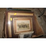 A box of various framed post-cards and photographs