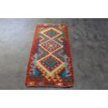 An approx. 4'7" x 2'1" Chobi Kilim rug