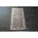 An approx. 3'10" x 2' Chinese style patterned rug