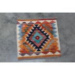 An approx 1'6" x 1'5" Chobi Kilim rug