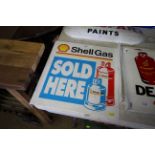 A Shell Gas Sold Here double sided metal sign